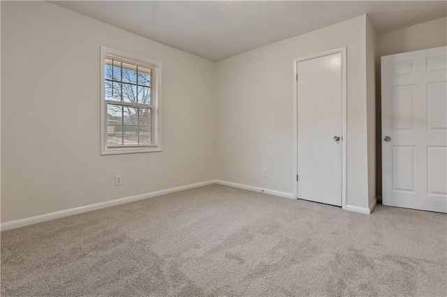 unfurnished bedroom featuring light colored carpet