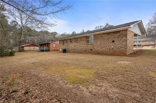 back of property with central AC unit