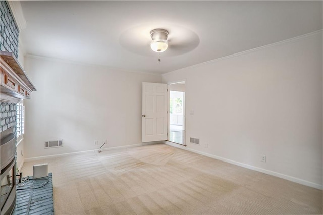 3323 Lancing Ct, Duluth, GA 30096 - spare room with crown molding, a ceiling fan, a fireplace, light colored carpet, and baseboards