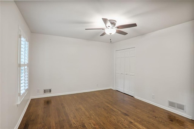 3323 Lancing Ct, Duluth, GA 30096 - empty room with a ceiling fan, baseboards, and dark wood-type flooring