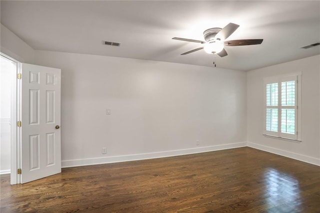 3323 Lancing Ct, Duluth, GA 30096 - spare room featuring dark wood-style flooring, ceiling fan, and baseboards