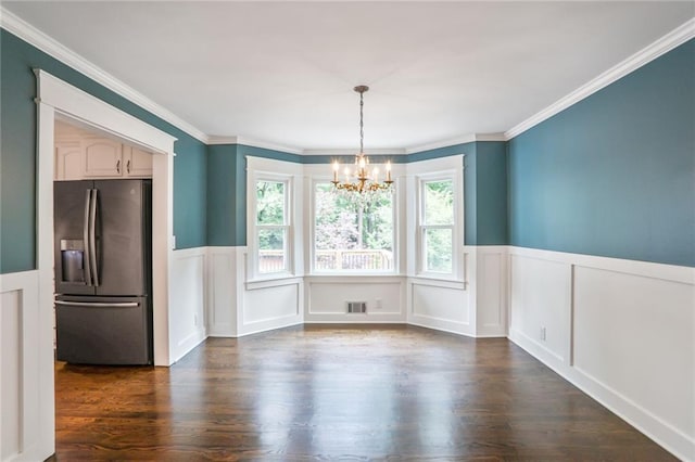 3323 Lancing Ct, Duluth, GA 30096 - unfurnished dining area featuring a chandelier, dark wood-type flooring, a wainscoted wall, a decorative wall, and ornamental molding