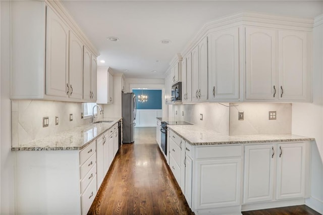 3323 Lancing Ct, Duluth, GA 30096 - kitchen featuring appliances with stainless steel finishes, a sink, dark wood-type flooring, light stone countertops, and white cabinets