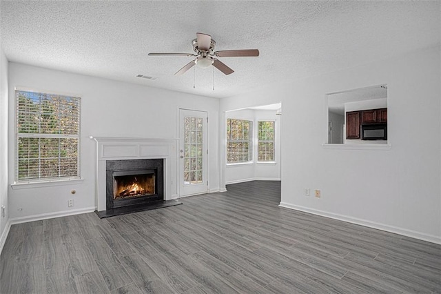 spare room with ceiling fan and dark wood-type flooring