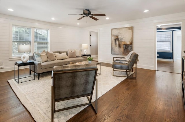 living area with recessed lighting, a healthy amount of sunlight, and wood finished floors