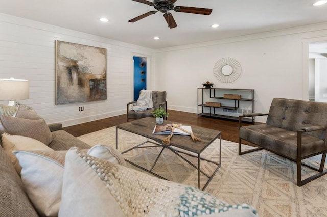 living area with recessed lighting, baseboards, and wood finished floors