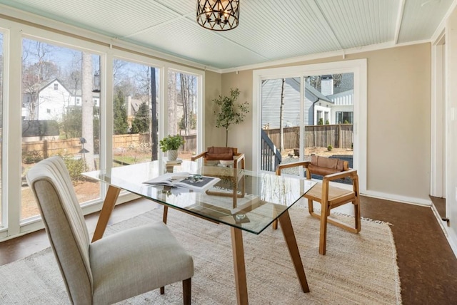 dining room featuring baseboards and a chandelier