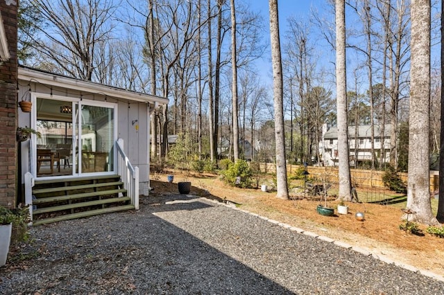 view of yard with entry steps