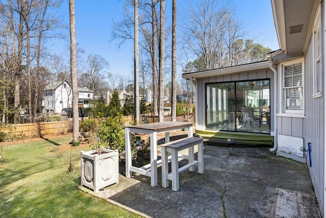 view of patio / terrace featuring fence