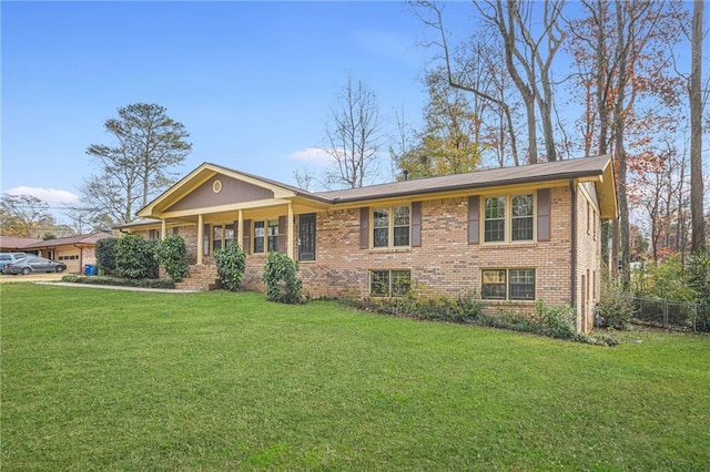 view of front facade featuring a front lawn and covered porch