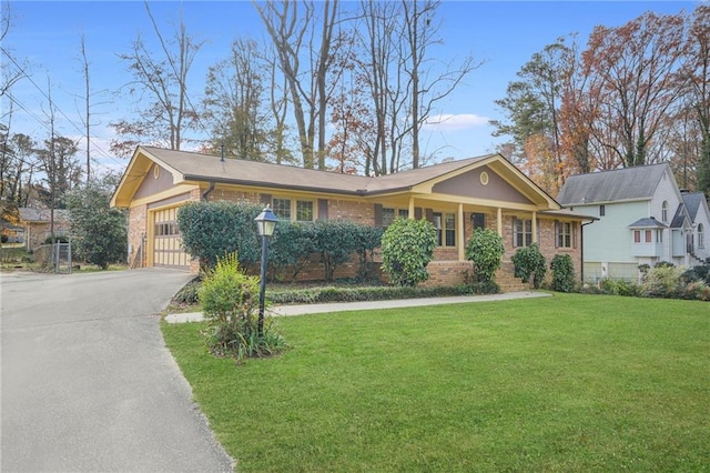 ranch-style home with a front yard and a garage