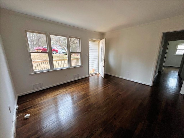 empty room featuring dark hardwood / wood-style flooring