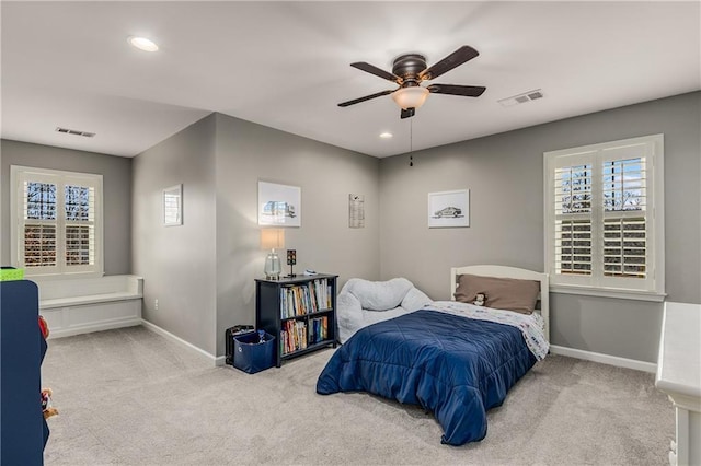 carpeted bedroom featuring baseboards, visible vents, and recessed lighting