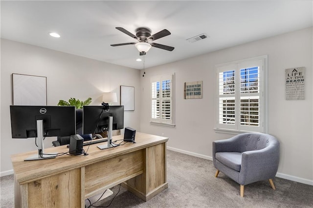 office space featuring recessed lighting, ceiling fan, baseboards, and light colored carpet