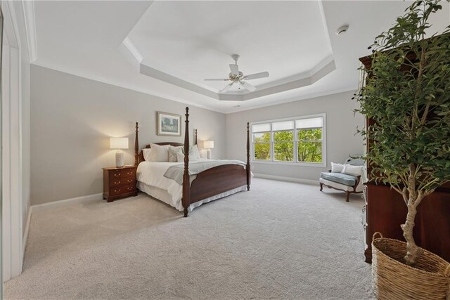 4790 Hyde Rd, Cumming, GA 30040 - bedroom with a tray ceiling, baseboards, carpet, a ceiling fan, and ornamental molding