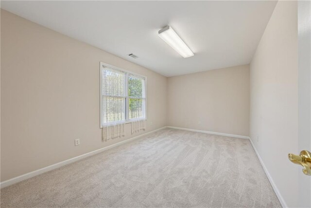 4790 Hyde Rd, Cumming, GA 30040 - unfurnished room featuring light colored carpet, baseboards, and visible vents
