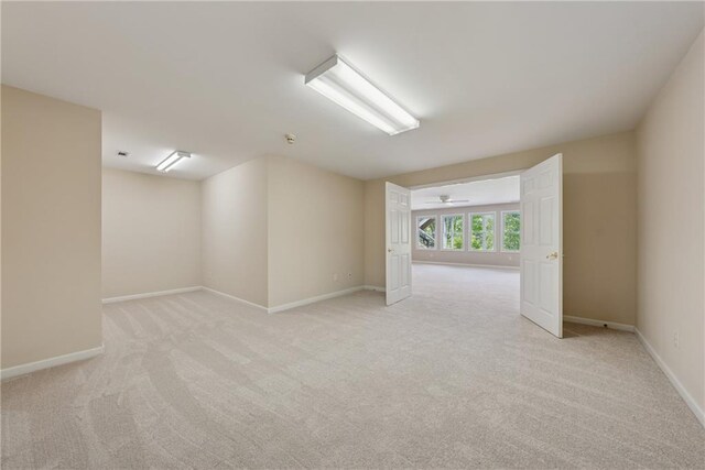 4790 Hyde Rd, Cumming, GA 30040 - empty room featuring ceiling fan, baseboards, and light carpet