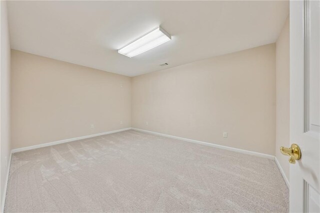 4790 Hyde Rd, Cumming, GA 30040 - spare room with visible vents, light carpet, and baseboards