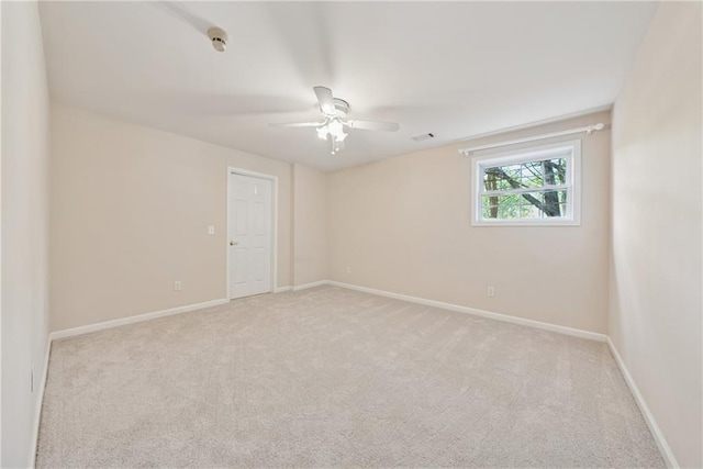 4790 Hyde Rd, Cumming, GA 30040 - spare room featuring ceiling fan, light carpet, visible vents, and baseboards