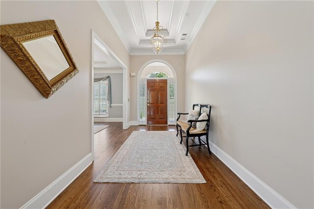 4790 Hyde Rd, Cumming, GA 30040 - entrance foyer with baseboards, wood finished floors, an inviting chandelier, and crown molding