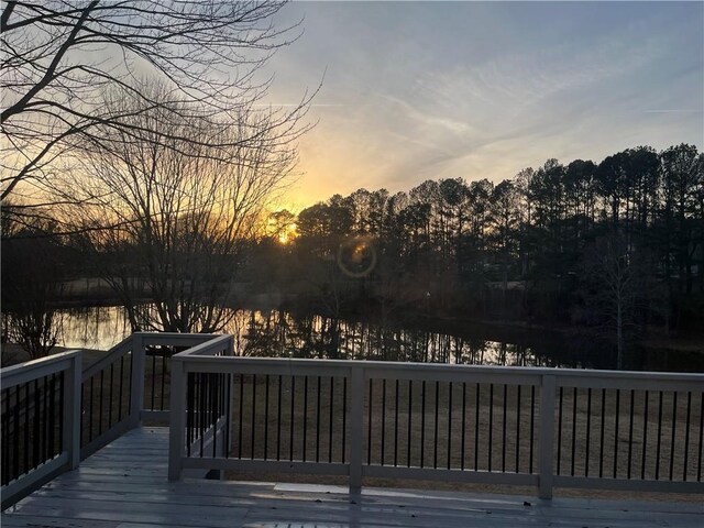 4790 Hyde Rd, Cumming, GA 30040 - deck at dusk featuring a water view