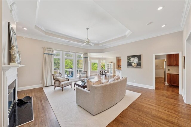 4790 Hyde Rd, Cumming, GA 30040 - living room featuring crown molding, baseboards, and a ceiling fan