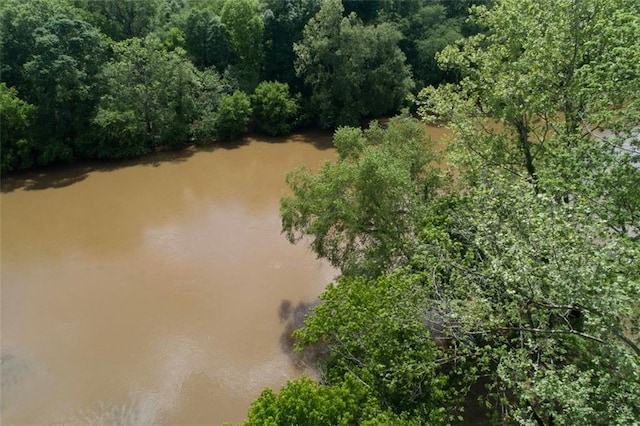 aerial view with a water view and a view of trees