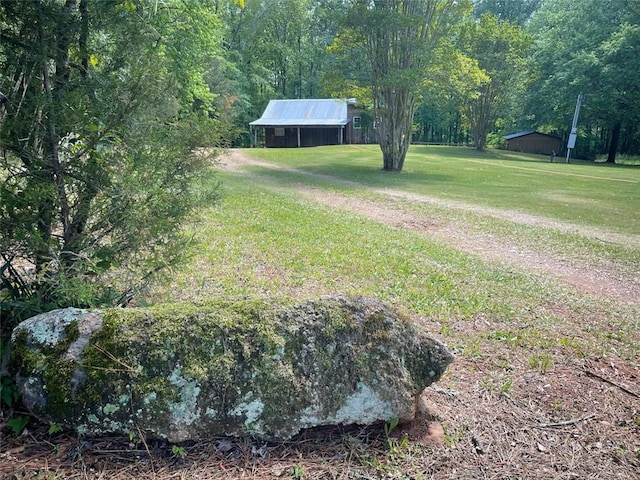view of yard featuring a wooded view