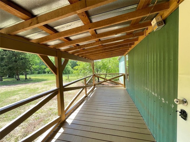 wooden terrace with a yard