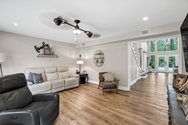 659 Creek Nation Rd, Jefferson, GA 30549 - living area featuring recessed lighting, light wood-type flooring, stairs, and french doors