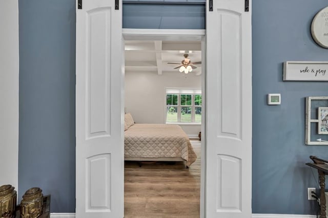 659 Creek Nation Rd, Jefferson, GA 30549 - bedroom with coffered ceiling, beamed ceiling, and wood finished floors