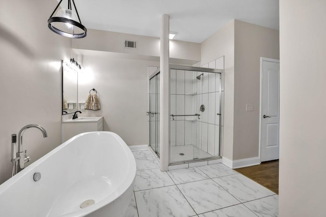 659 Creek Nation Rd, Jefferson, GA 30549 - full bathroom with a freestanding bath, a stall shower, vanity, and marble finish floors