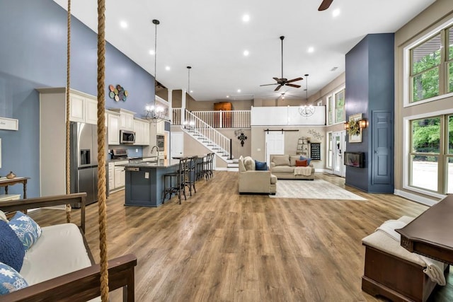 659 Creek Nation Rd, Jefferson, GA 30549 - living area with a ceiling fan, a high ceiling, light wood-type flooring, and recessed lighting