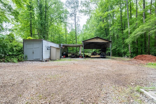 659 Creek Nation Rd, Jefferson, GA 30549 - view of yard featuring an outdoor structure and driveway