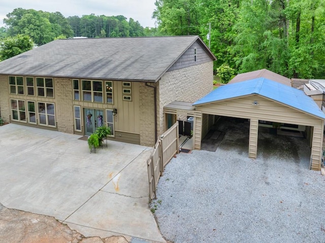 659 Creek Nation Rd, Jefferson, GA 30549 - view of front of property with a shingled roof, a detached garage, board and batten siding, and french doors