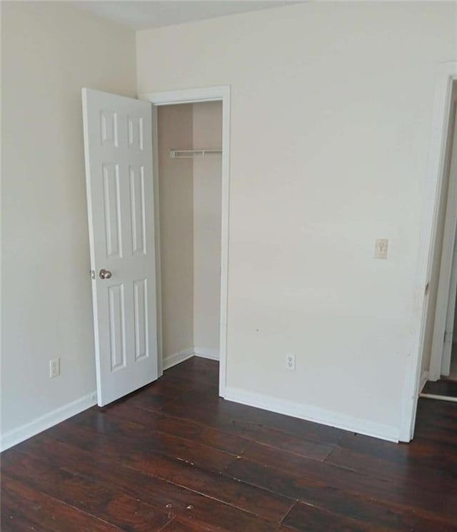 1017 Wheel House Ln Unit C, Monroe, GA 30655 - unfurnished bedroom with hardwood / wood-style flooring, baseboards, and a closet