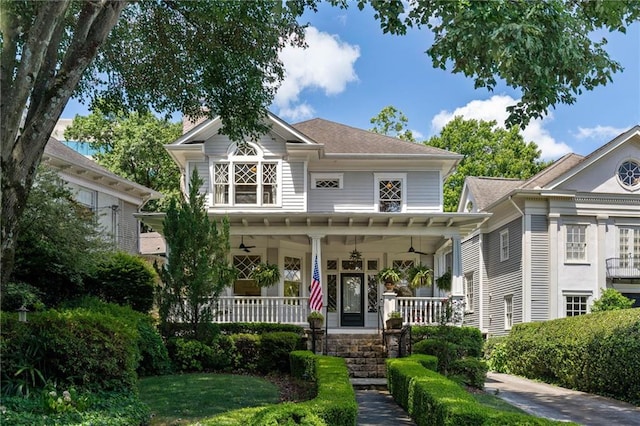 view of front of house featuring ceiling fan and covered porch