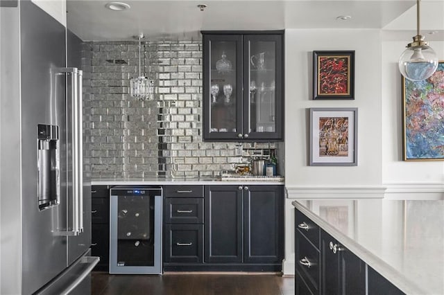 bar with high quality fridge, beverage cooler, dark hardwood / wood-style flooring, and decorative light fixtures