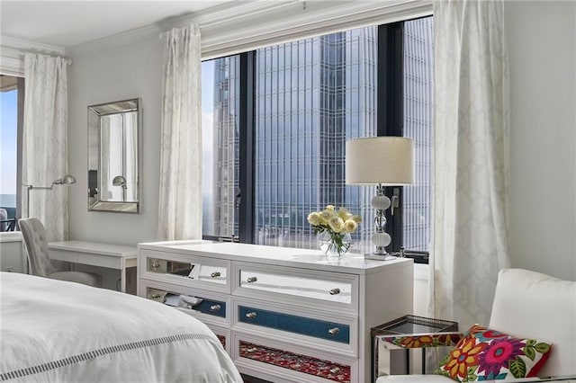 bedroom featuring multiple windows and ornamental molding