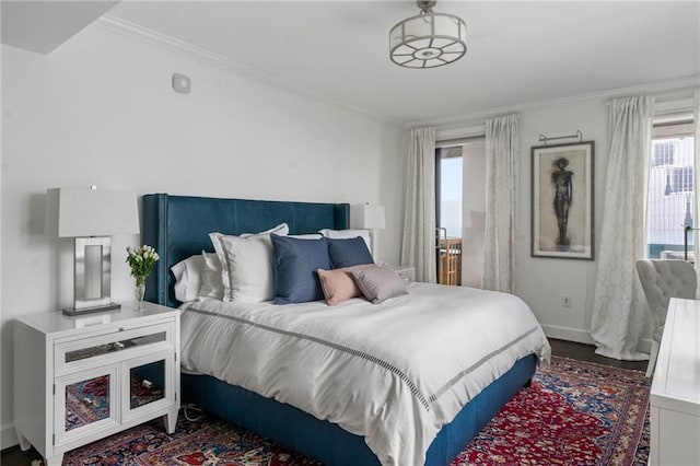 bedroom featuring crown molding and hardwood / wood-style flooring