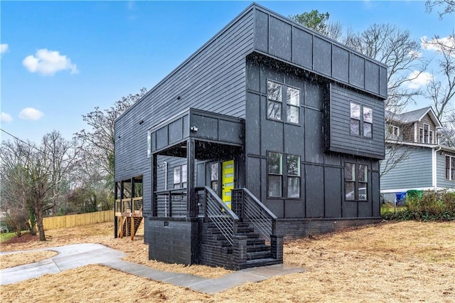 view of front of house with fence