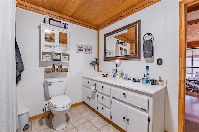 bathroom with tile patterned flooring, vanity, wood ceiling, and toilet