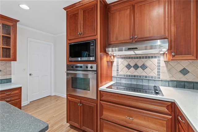 870 Richmond Hill Dr, Marietta, GA 30068 - kitchen featuring oven, under cabinet range hood, built in microwave, backsplash, and black electric cooktop
