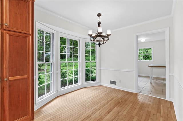 870 Richmond Hill Dr, Marietta, GA 30068 - unfurnished dining area with a chandelier, light wood-style flooring, crown molding, and baseboards