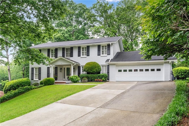 870 Richmond Hill Dr, Marietta, GA 30068 - colonial house with driveway, an attached garage, and a front lawn