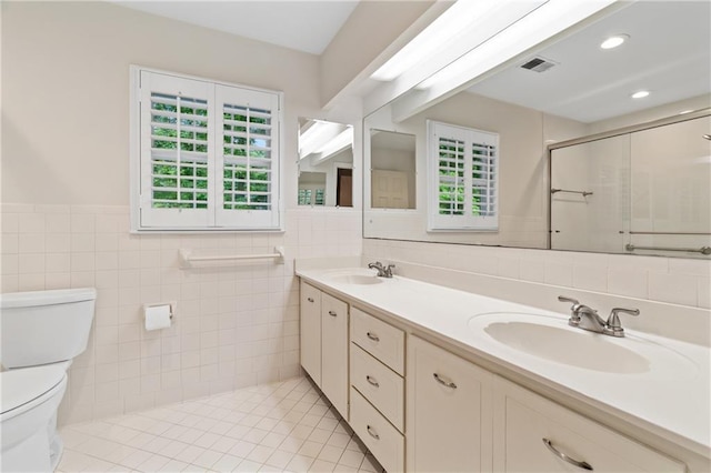 870 Richmond Hill Dr, Marietta, GA 30068 - bathroom with toilet, a shower stall, tile walls, double vanity, and tile patterned floors