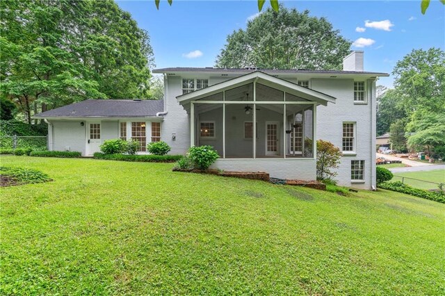 870 Richmond Hill Dr, Marietta, GA 30068 - back of property with a sunroom, a ceiling fan, a chimney, and brick siding