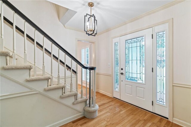 870 Richmond Hill Dr, Marietta, GA 30068 - foyer featuring ornamental molding, light wood-type flooring, stairway, a chandelier, and baseboards