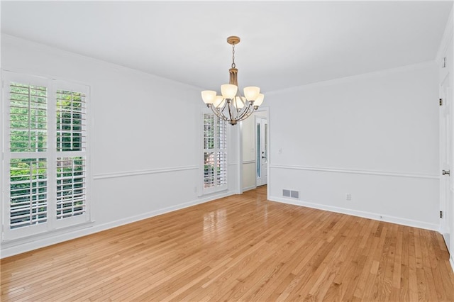 870 Richmond Hill Dr, Marietta, GA 30068 - unfurnished room with a chandelier, ornamental molding, light wood-style flooring, and baseboards