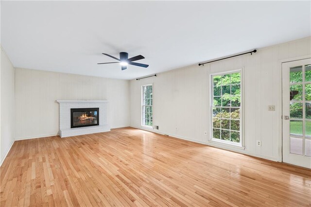 870 Richmond Hill Dr, Marietta, GA 30068 - unfurnished living room featuring light wood finished floors, ceiling fan, and plenty of natural light